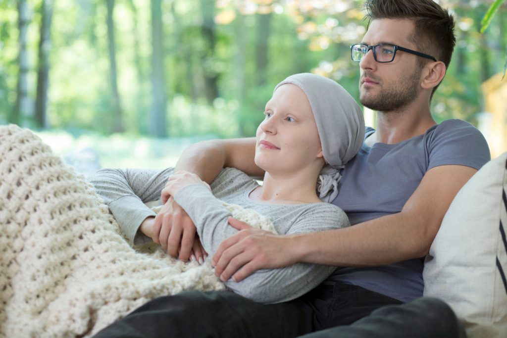 boyfriend with their cancer stricken girlfriend at home